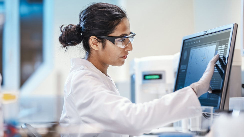 A researcher looks at research data gathered during a rare disease study.