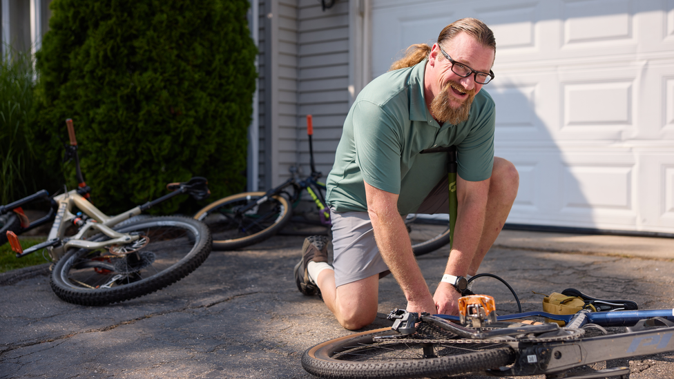 An inflammation clinical research study participant works outside of his home.