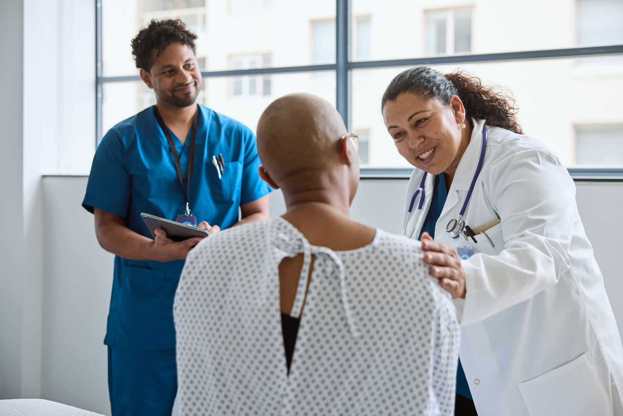 A doctor speaks to a patient who wants to learn how to participate in clinical trials about his health and medical history.