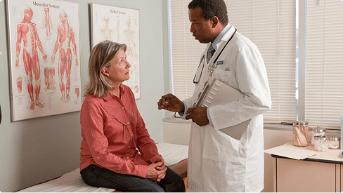 A doctor speaks to a patient about a study for treating inflammation.