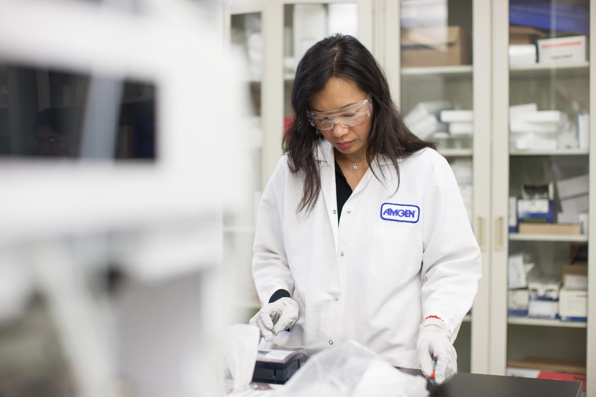 A medical research team member examines study data for a colorectal cancer research study.
