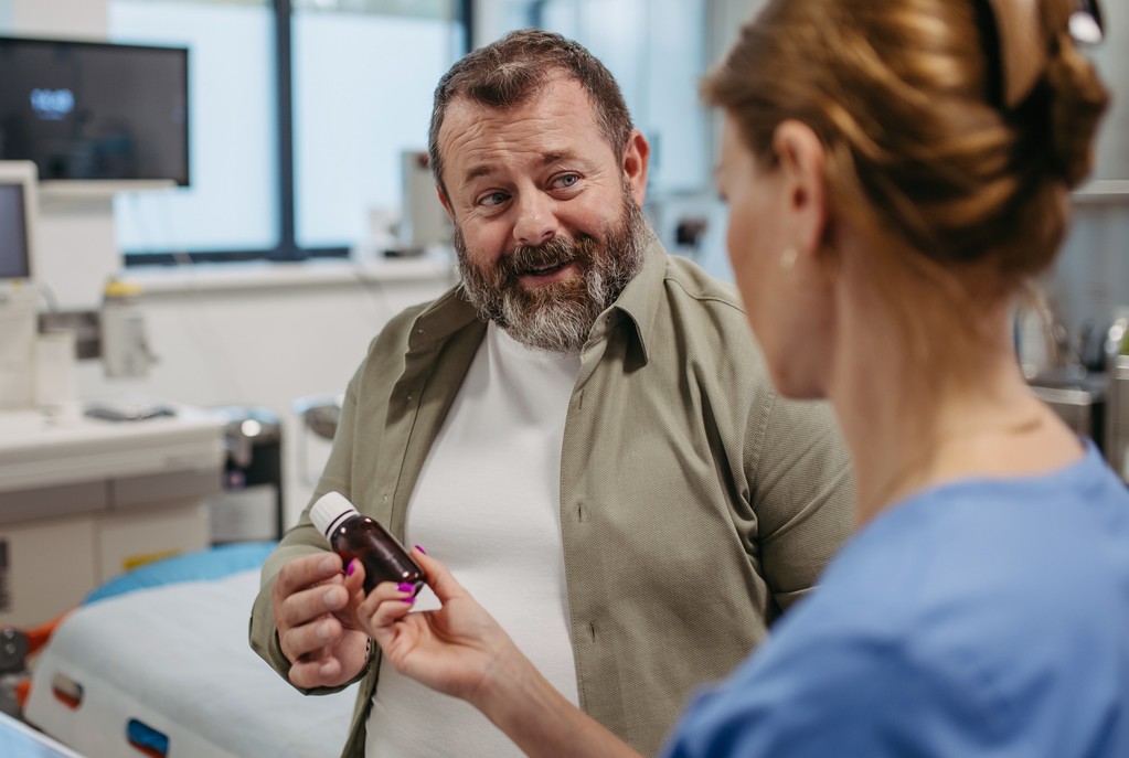 A patient and doctor discuss the benefits of an obesity clinical study.