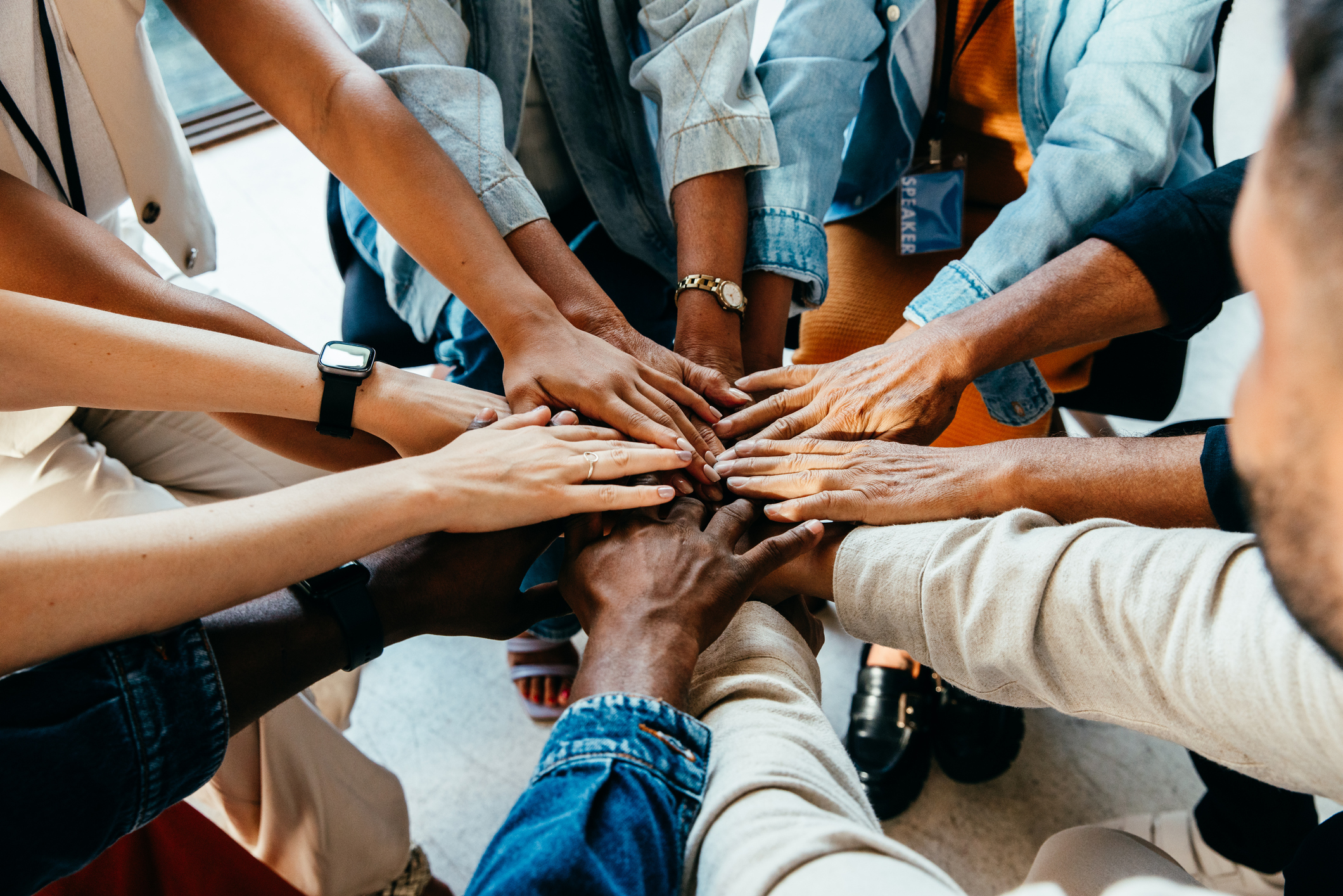 Former clinical study participants touch hands after participating in a successful research study.