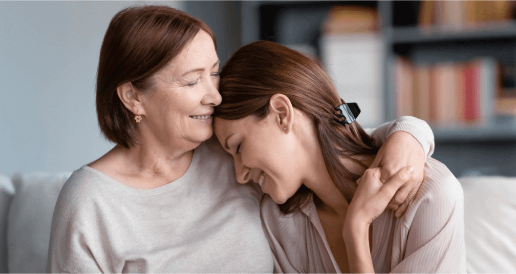 Woman hugging her daughter