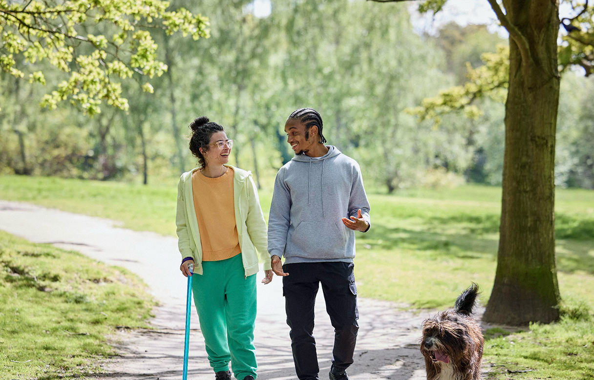 Man and woman walking in a forest