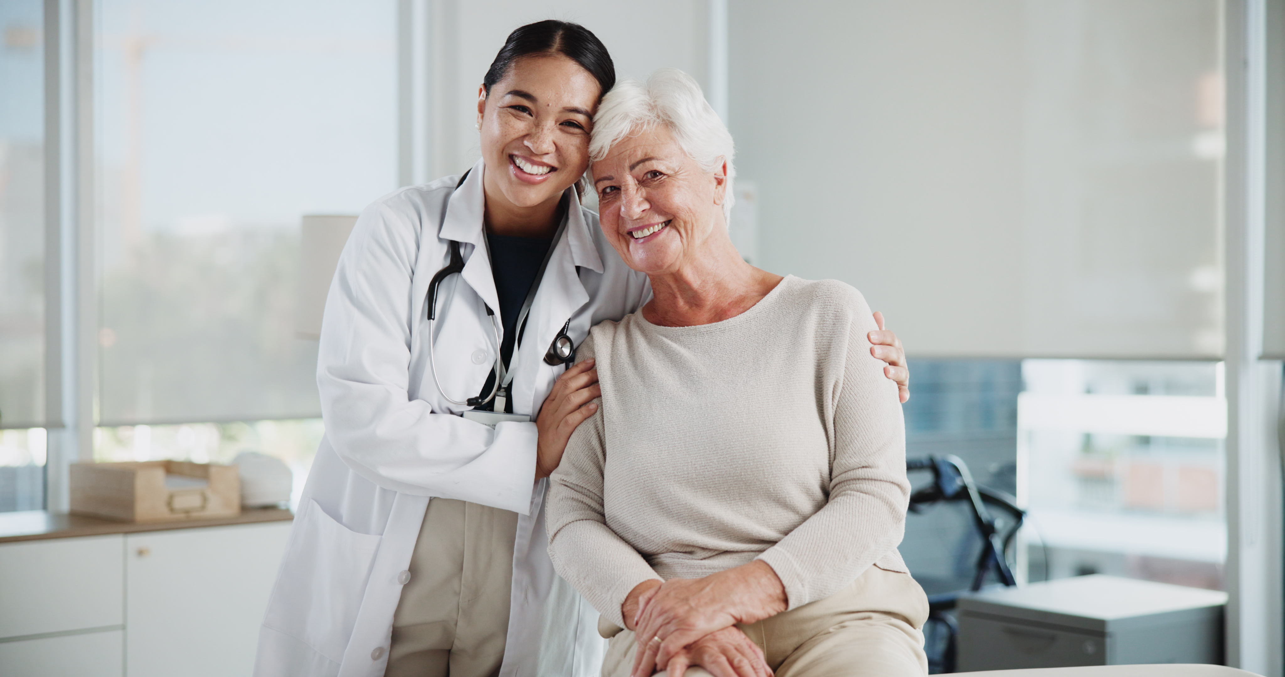 A doctor and patient smiling about the impact of a new possible treatment on clinical study participants.